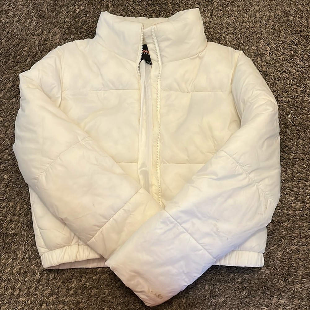 White puffer jacketed, size medium, stained